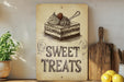 a sign that says sweet treats on it