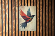 a picture of a bird on a wooden wall