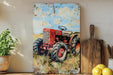 a painting of a red tractor on a white wall
