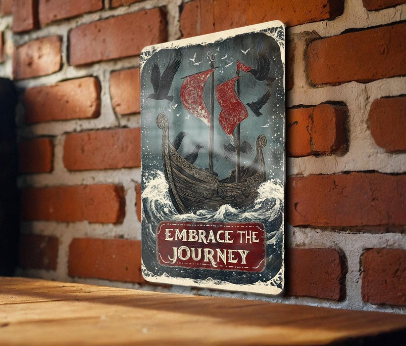 a sign on a brick wall that says embrace the journey