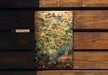 a wooden bench with a map on it