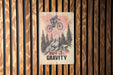a sign on a wooden wall that says defy gravity