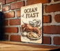 a sign on a brick wall that says ocean feast
