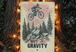 a sign that says defy gravity on a tree