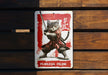 a sign with a cat holding a sword