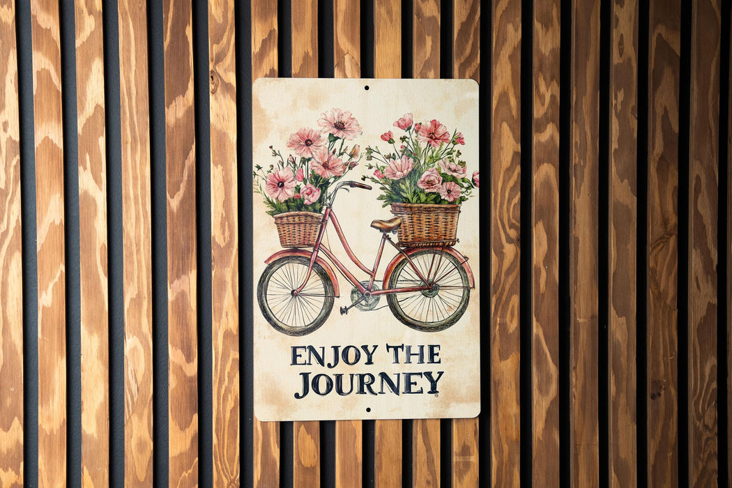 a sign that says enjoy the journey on a wooden wall