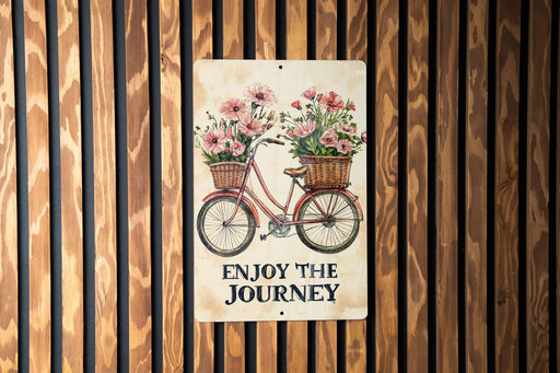 a sign that says enjoy the journey on a wooden wall