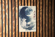 a picture of a wolf on a wooden wall