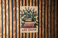 a sign on a wooden wall that says learn and grow