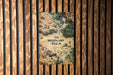 a book on a wooden paneled wall