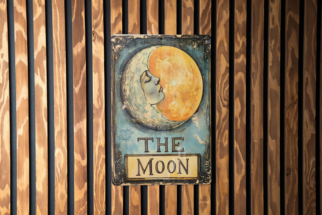 a sign on a wooden wall that says the moon