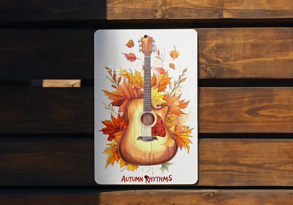 a picture of a guitar with autumn leaves on it