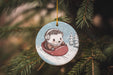 a christmas ornament hanging from a christmas tree