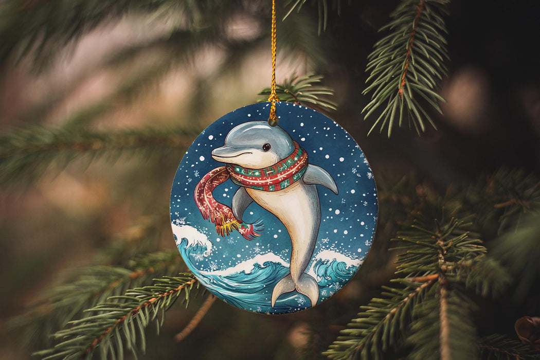 a dolphin ornament hanging from a christmas tree