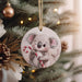 a christmas ornament with a koala holding a candy cane