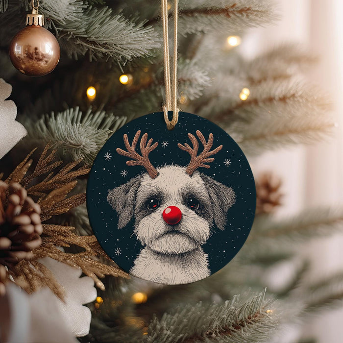 a christmas ornament with a dog wearing reindeer antlers