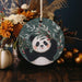 a ceramic ornament with a panda bear on it