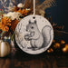 a ceramic ornament with a picture of a squirrel