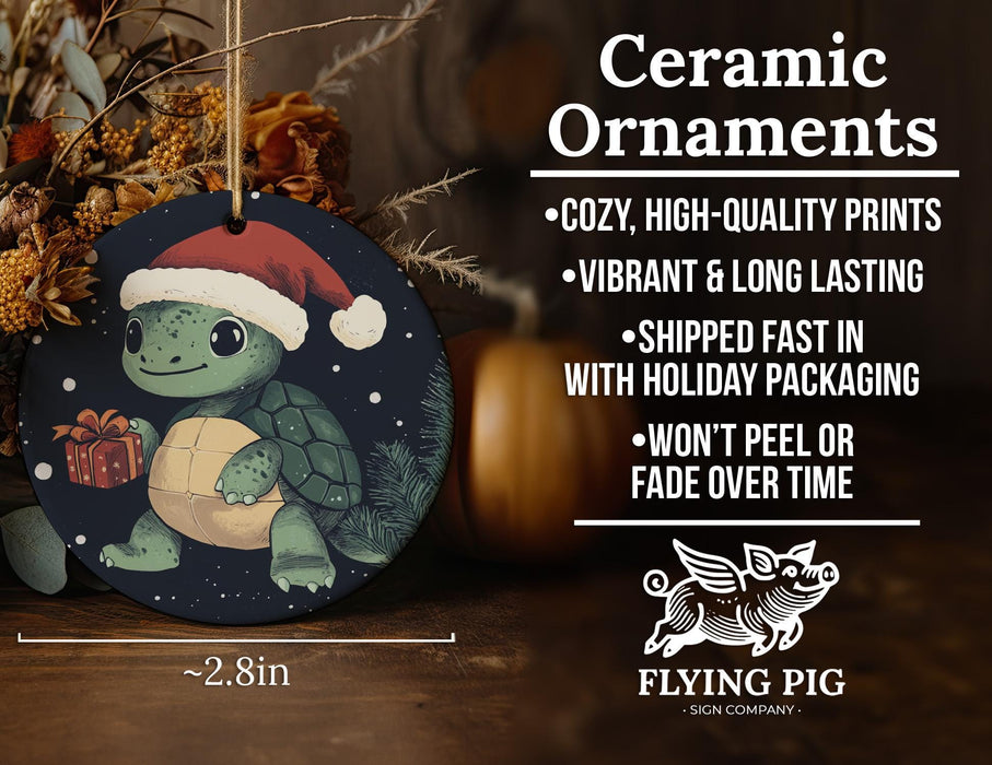 a christmas ornament with a turtle holding a present