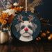 a christmas ornament with a dog wearing reindeer antlers