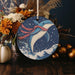 a christmas ornament with a dolphin on it