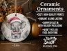 a ceramic ornament with an elephant wearing a santa hat