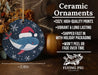 a ceramic ornament with a whale wearing a santa hat
