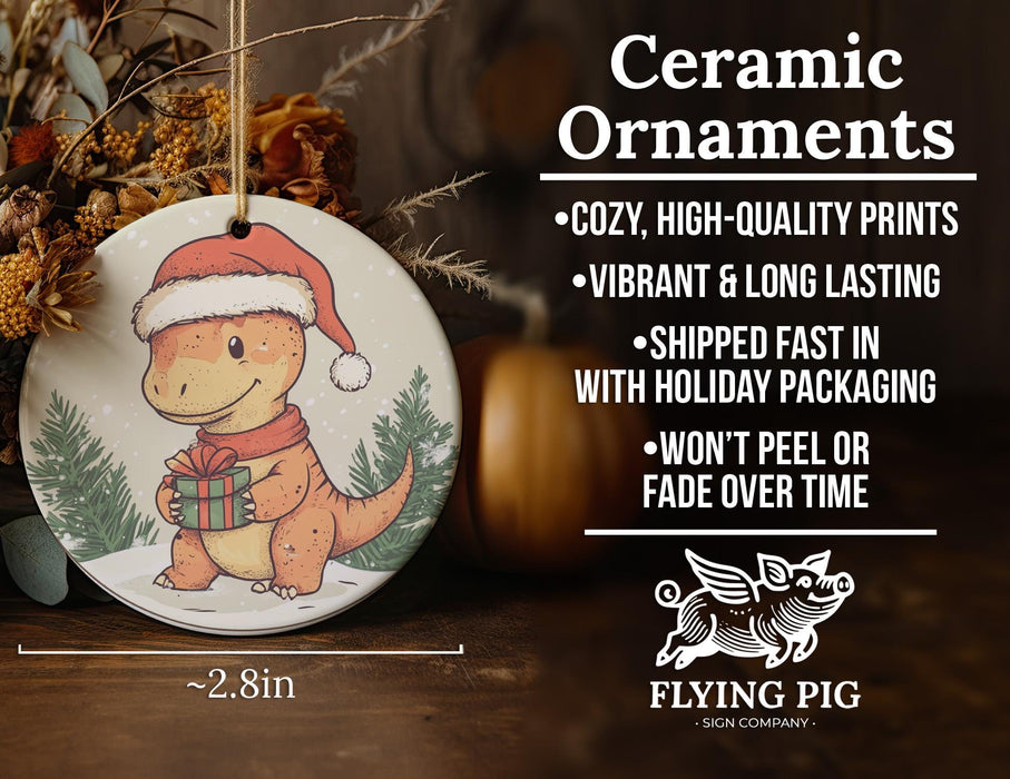 a ceramic ornament with a dinosaur wearing a santa hat