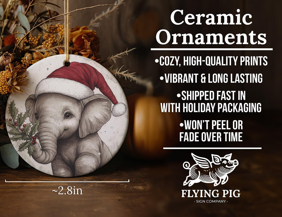 a ceramic ornament with an elephant wearing a santa hat