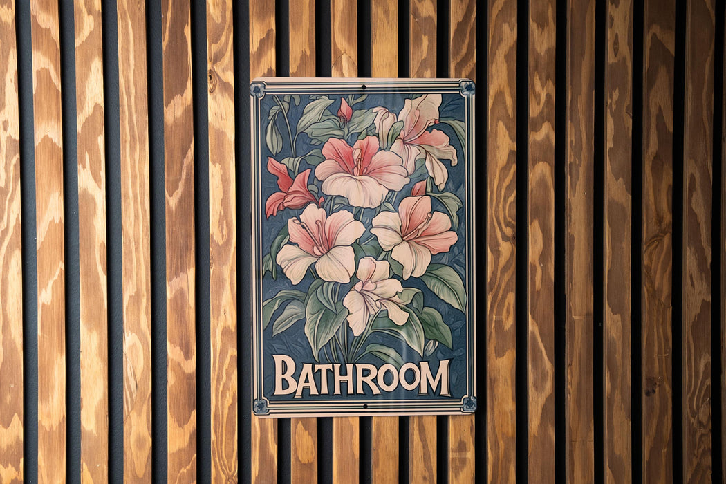 a bathroom sign hanging on a wooden wall