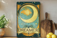 a painting of a moon and the words dream on it