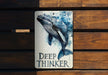 a picture of a dolphin on a wooden bench