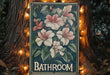 a bathroom sign with lights around it on a tree