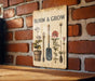 a sign on a brick wall that says bloom and grow