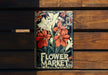 a flower market book sitting on top of a wooden bench