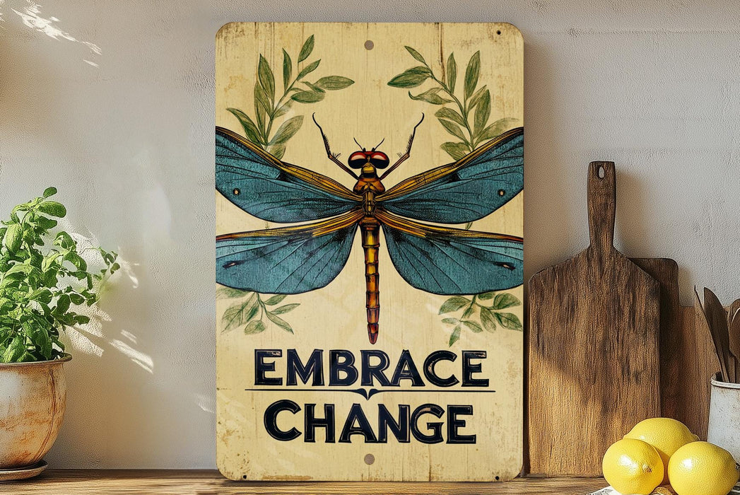 a sign that says embrace change with a dragonfly on it