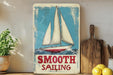 a painting of a sailboat on a shelf