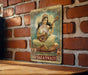 a picture of a woman playing a guitar on a brick wall