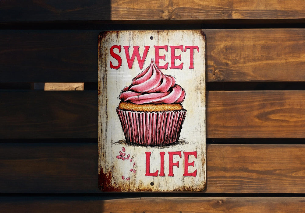 a sign that says sweet life with a cupcake on it