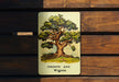 a picture of a tree on a wooden bench