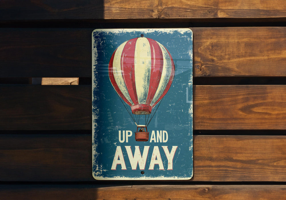 a sign that says up and away with a hot air balloon