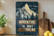 a wooden sign that says adventure is out there