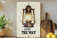 a picture of a light the way sign on a shelf