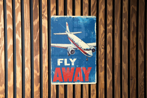 a sign on a wooden wall that says fly away