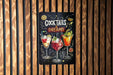 a sign advertising cocktails on a wooden wall