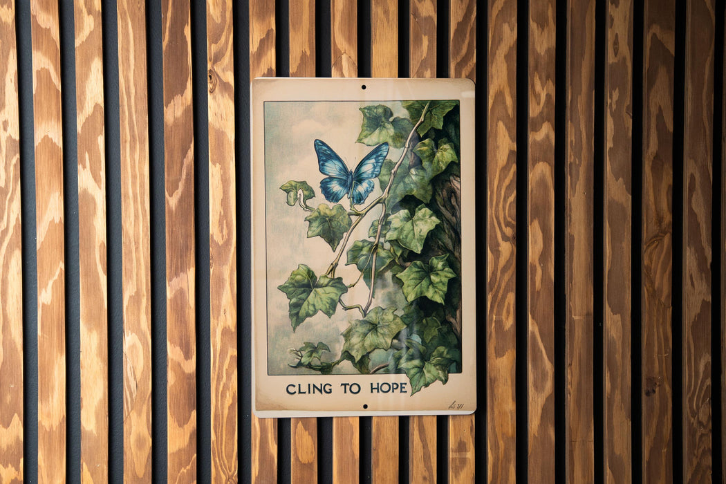 a picture of a blue butterfly on a wooden wall