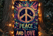 a peace and love sign hanging on a tree