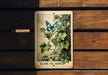 a picture of a butterfly on a wooden bench