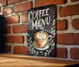 a sign on a brick wall that says coffee menu