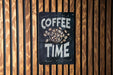 a coffee time sign on a wooden wall